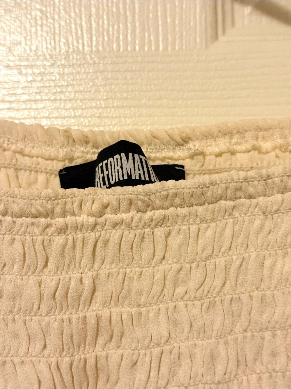 Reformation Smocked Off-Shoulder Long Sleeve Top — Cream